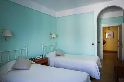 Letto o letti in una camera di Hotel San Genesio