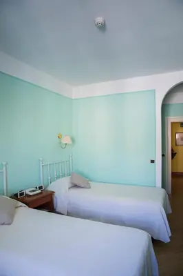 Letto o letti in una camera di Hotel San Genesio
