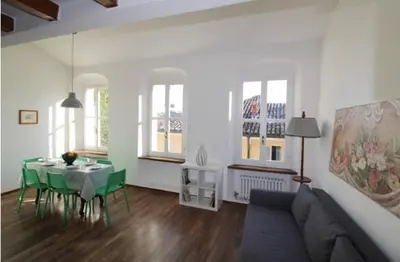 Area soggiorno di Penthouse in the center of Parma - bookable parking space