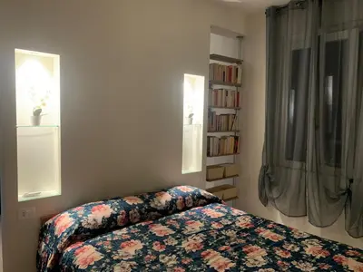 Letto o letti in una camera di Casa Luna