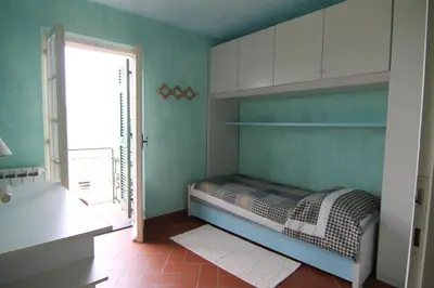 Letto o letti in una camera di Five Lands Pink Cottage