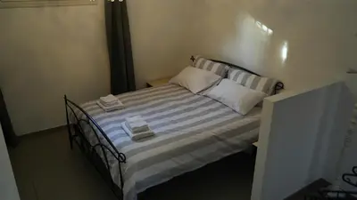 Letto o letti in una camera di JD Suite Apartment near Ferrari