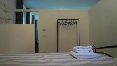 Letto o letti in una camera di JD Suite Apartment near Ferrari