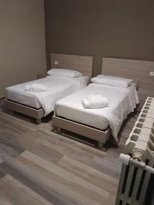 Letto o letti in una camera di OSTERIA IL BECCO FINE affittacamere