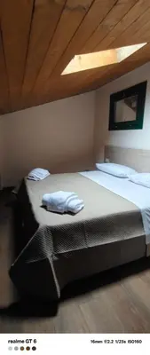 Letto o letti in una camera di OSTERIA IL BECCO FINE affittacamere