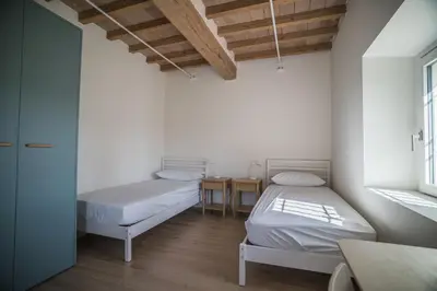 Letto o letti in una camera di Casa per ferie Cà Monte - Borzano di Albinea