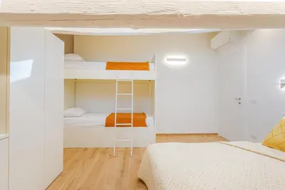 Letto o letti in una camera di Corso Adriano 13 - Via Emilia