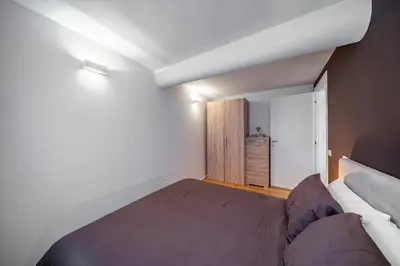 Letto o letti in una camera di Appartamento LAURA - Residenze Estensi