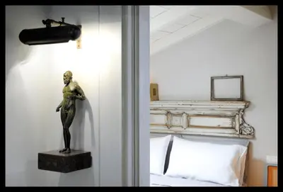 Letto o letti in una camera di Quartopiano Modena