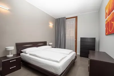 Letto o letti in una camera di Appartamenti Torre del Capitano