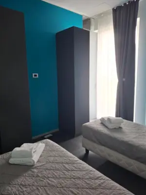 Letto o letti in una camera di Appartamento Mantova Residence