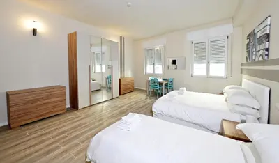 Letto o letti in una camera di City Loft
