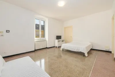 Letto o letti in una camera di 318B - Il Rifugio sul Porto, a pochi passi dal Lungomare e dal Centro di Lavagna