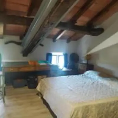Letto o letti in una camera di Ampia stanza nelle campagne parmensi