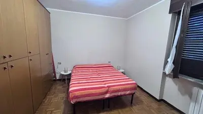 Letto o letti in una camera di Ampio bilocale a pochi passi dal centro e dalla stazione