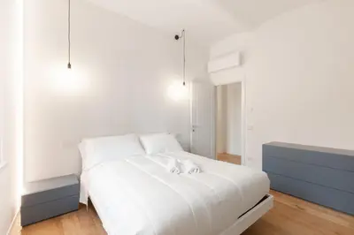 Letto o letti in una camera di Modena Charme Via de' Fogliani