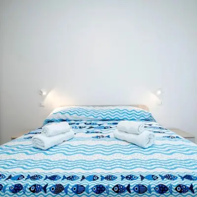 Letto o letti in una camera di Mare fuori, sul lungomare con tre camere da letto e due bagni!