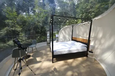 Letto o letti in una camera di La Luna sul Bosco Bubble Rooms