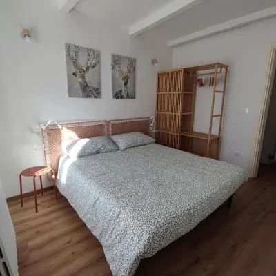 Letto o letti in una camera di Charme a Corniglio