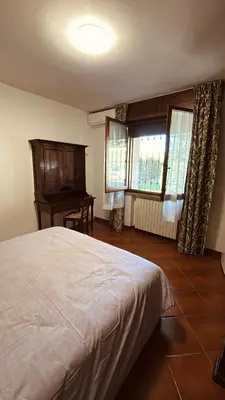 Letto o letti in una camera di Villa Marisa