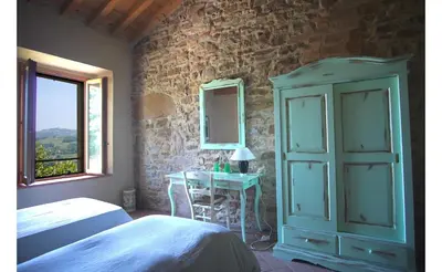 Letto o letti in una camera di SacreTerre B&B e Agriturismo