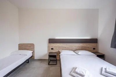 Letto o letti in una camera di Residence La Luma