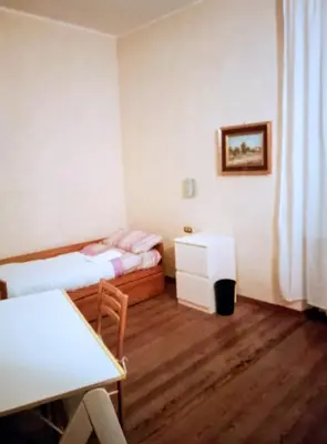 Letto o letti in una camera di A un passo dal centro gli orsetti del duomo