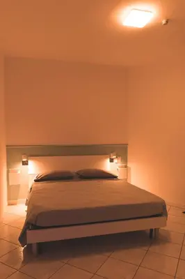 Letto o letti in una camera di WowMilano Escape