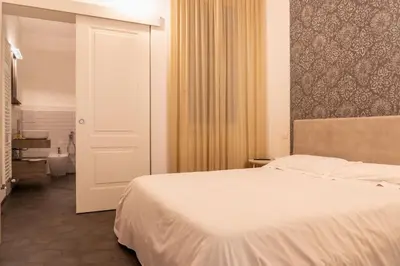 Letto o letti in una camera di Emilia Suite Edition
