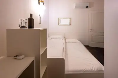 Letto o letti in una camera di Emilia Suite Edition