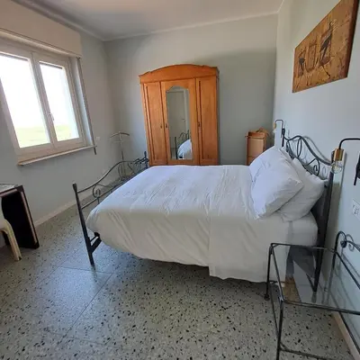 Letto o letti in una camera di B&B La Magnolia