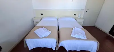Letto o letti in una camera di La Colombera Ristorante - Albergo