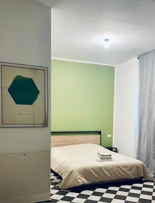 Letto o letti in una camera di La foresteria dell'Abate - Reggio Emilia centro storico