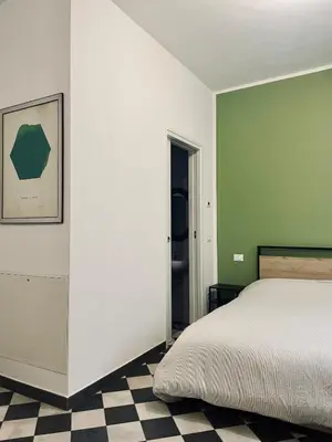 Letto o letti in una camera di La foresteria dell'Abate - Reggio Emilia centro storico
