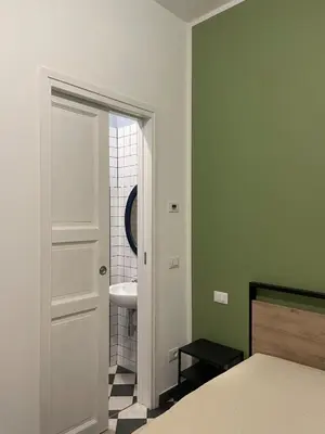Letto o letti in una camera di La foresteria dell'Abate - Reggio Emilia centro storico