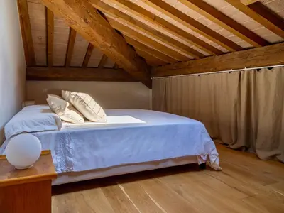 Letto o letti in una camera di Penthouse in Palazzo San Donnini