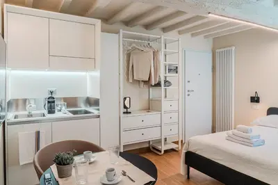 Letto o letti in una camera di La Torre DOWNTOWN ROOM CAMERA A REGGIO EMILIA