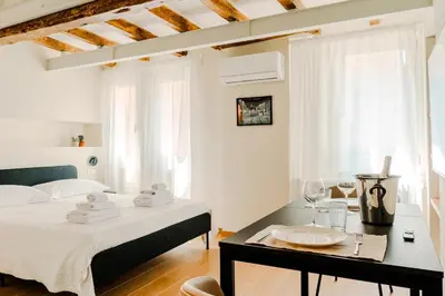 Letto o letti in una camera di I leoni - Downtown room camera in centro a Reggio Emilia