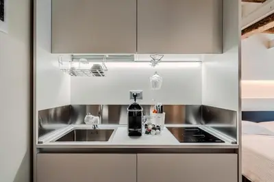 Cucina o angolo cottura di I leoni - Downtown room camera in centro a Reggio Emilia
