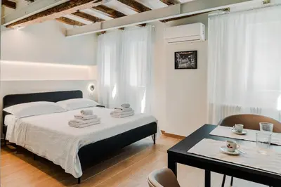 Letto o letti in una camera di I leoni - Downtown room camera in centro a Reggio Emilia