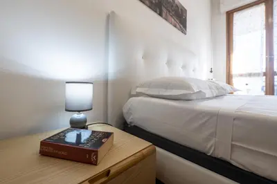 Letto o letti in una camera di QuattroTrentasei