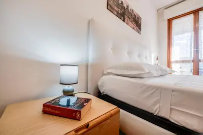 Letto o letti in una camera di QuattroTrentasei
