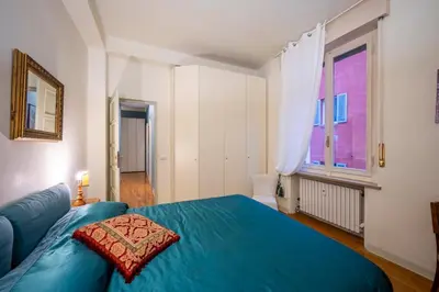 Letto o letti in una camera di B&B San Giovanni Parma