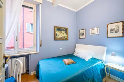 Letto o letti in una camera di B&B San Giovanni Parma
