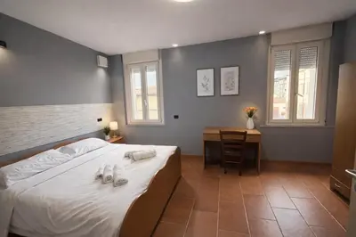 Letto o letti in una camera di Palazzo Gregorio