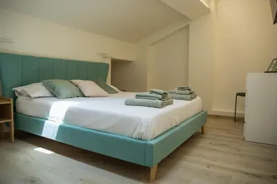 Letto o letti in una camera di Ghiara Apartment Reggio Emilia historic center