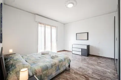 Letto o letti in una camera di IZZ1 Apartments Plus - Motor&Food Valley