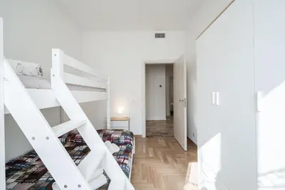 Letto o letti in una camera di IZZ1 Apartments Plus - Motor&Food Valley