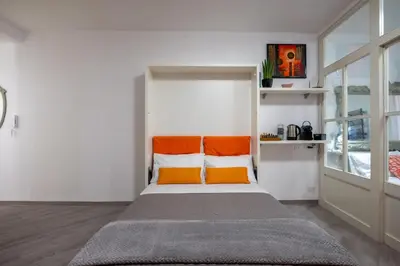 Letto o letti in una camera di Le Finestre su Via Veneto
