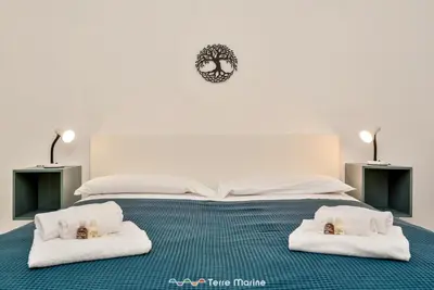 Letto o letti in una camera di Tik Tok, TerreMarine